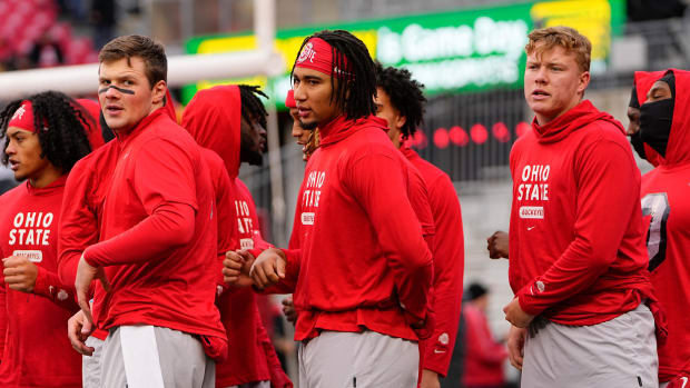 Ohio State Buckeyes quarterbacks, from left, Kyle McCord, C.J. Stroud and Devin Brown warm up prior to the NCAA football game against the Indiana Hoosiers at Ohio Stadium.